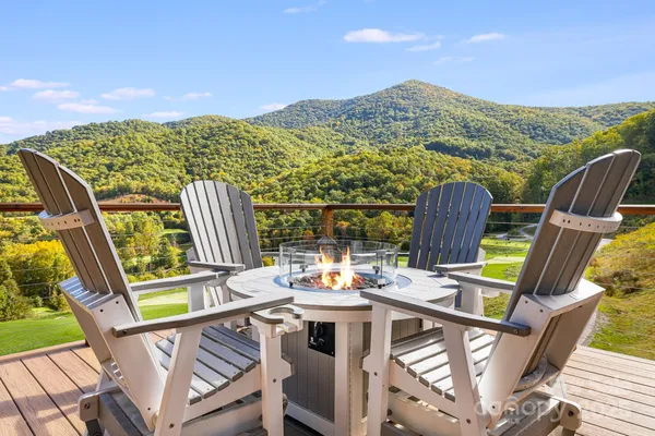 a view of city from balcony with furniture