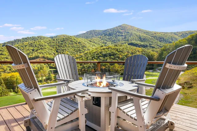 a view of city from balcony with furniture
