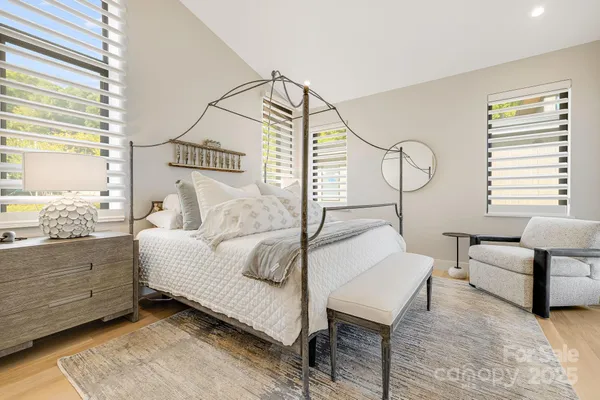 a bedroom with furniture and a window