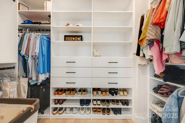 a view of a bathroom with washing machine and a sink