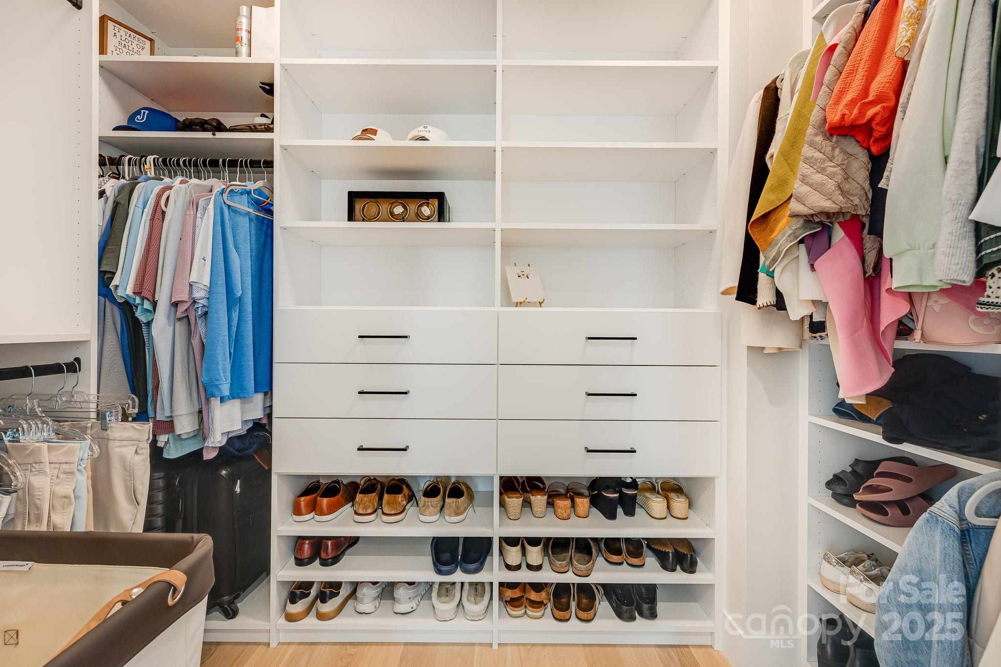 13 Switchgrass Way, Unit 407 Sylva, NC 28779 - Photo 18 of 48 a view of walk in closet with clothes and shoes