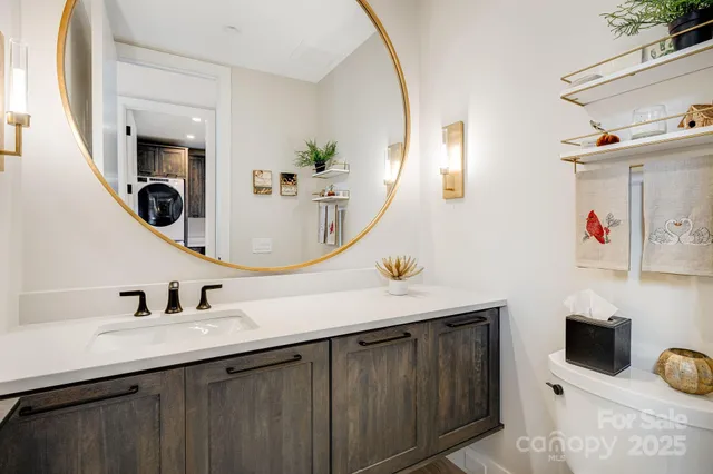 a view of a livingroom with furniture and a flat screen tv