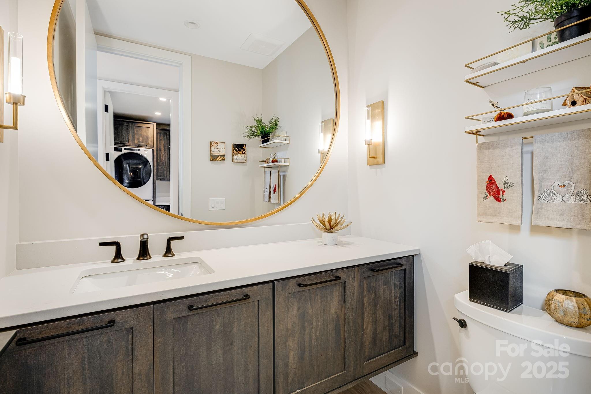 13 Switchgrass Way, Unit 407 Sylva, NC 28779 - Photo 20 of 48 a bathroom with a sink and a mirror