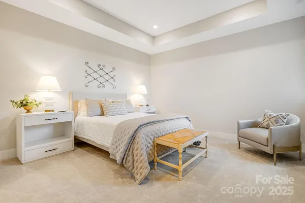 a bedroom with a bed and a couch