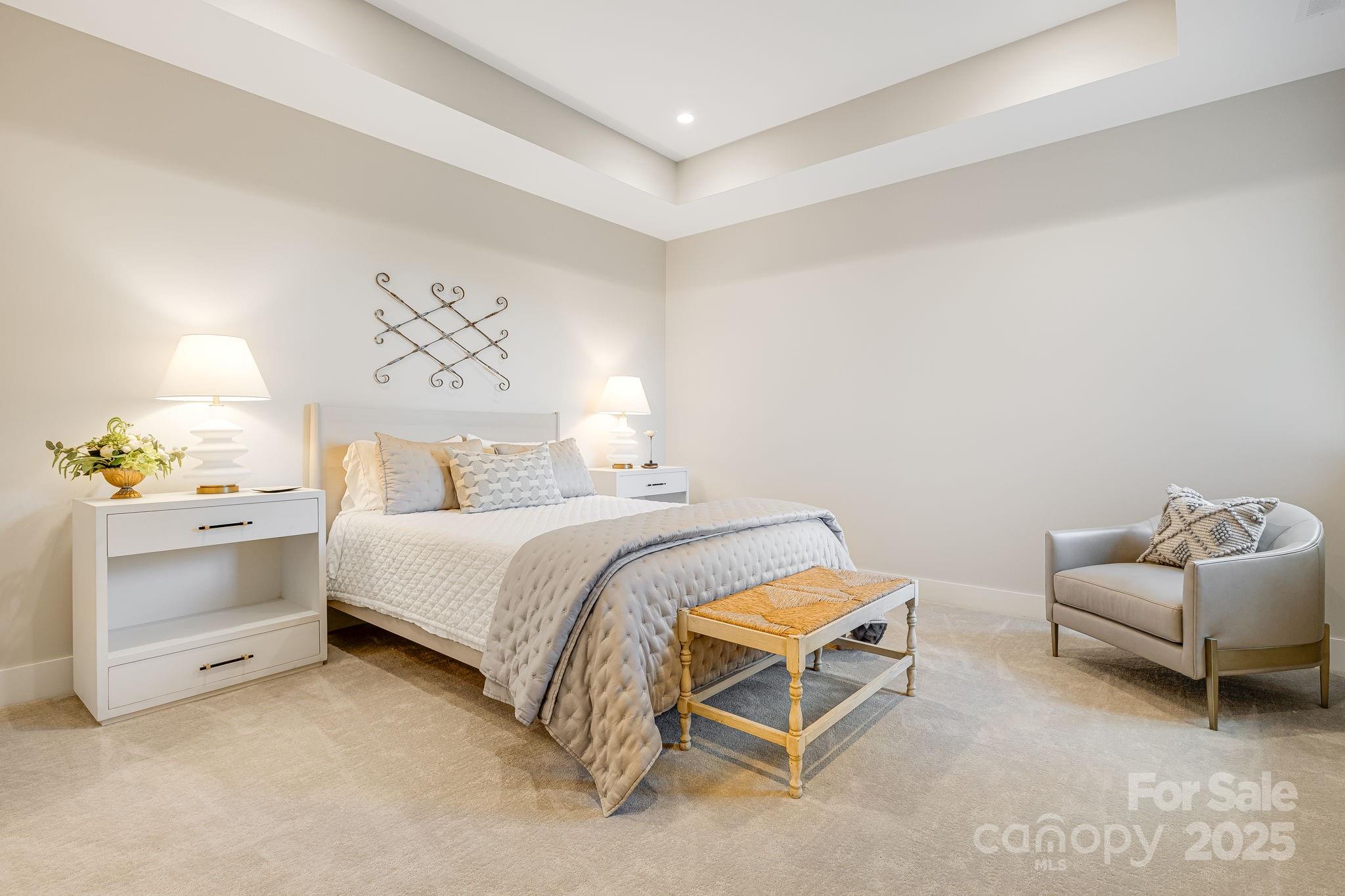 13 Switchgrass Way, Unit 407 Sylva, NC 28779 - Photo 30 of 48 a bedroom with a bed and a couch