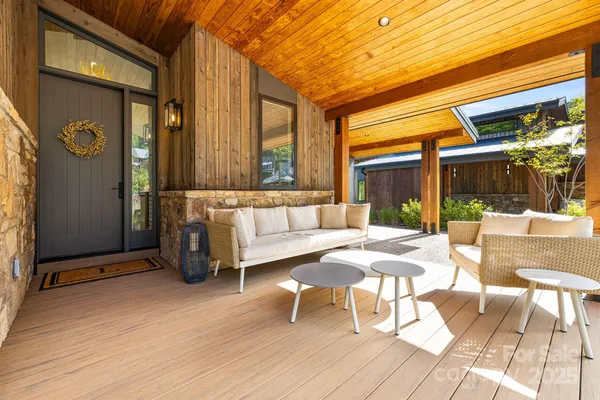 a living room with furniture and a table