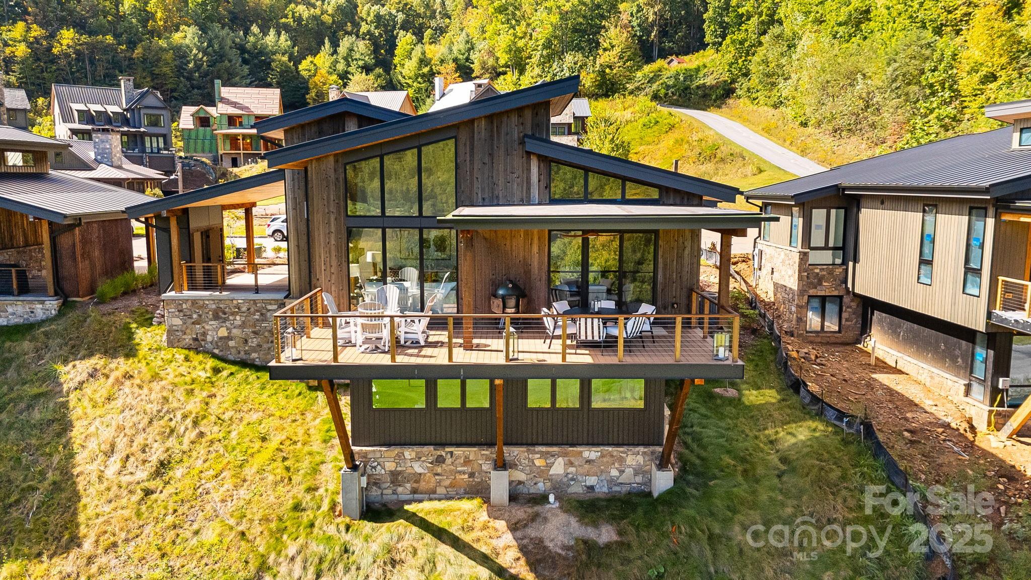 13 Switchgrass Way, Unit 407 Sylva, NC 28779 - Photo 33 of 48 a front view of a house with swimming pool