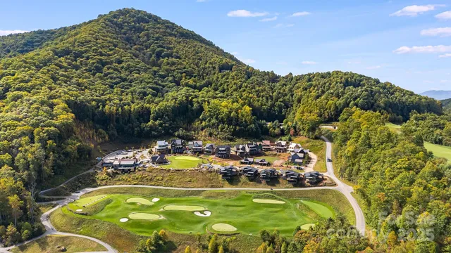 a view of a swimming pool with a yard