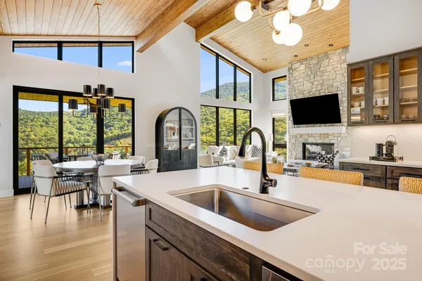 a kitchen with a sink and a large window