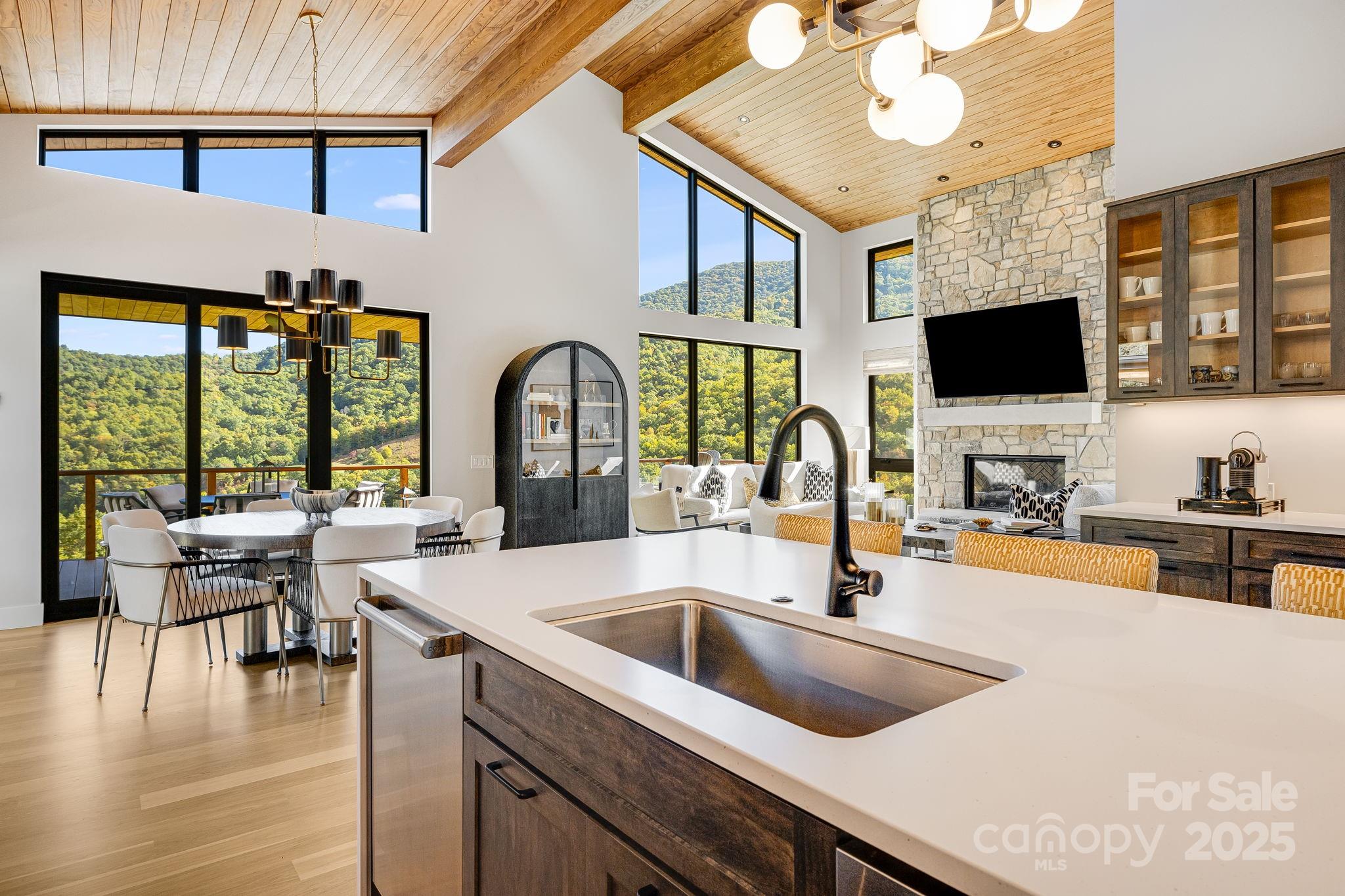 13 Switchgrass Way, Unit 407 Sylva, NC 28779 - Photo 8 of 48 a kitchen with a sink and a large window