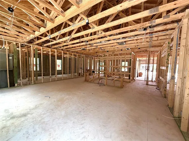 a kitchen with granite countertop a sink and a wooden floor