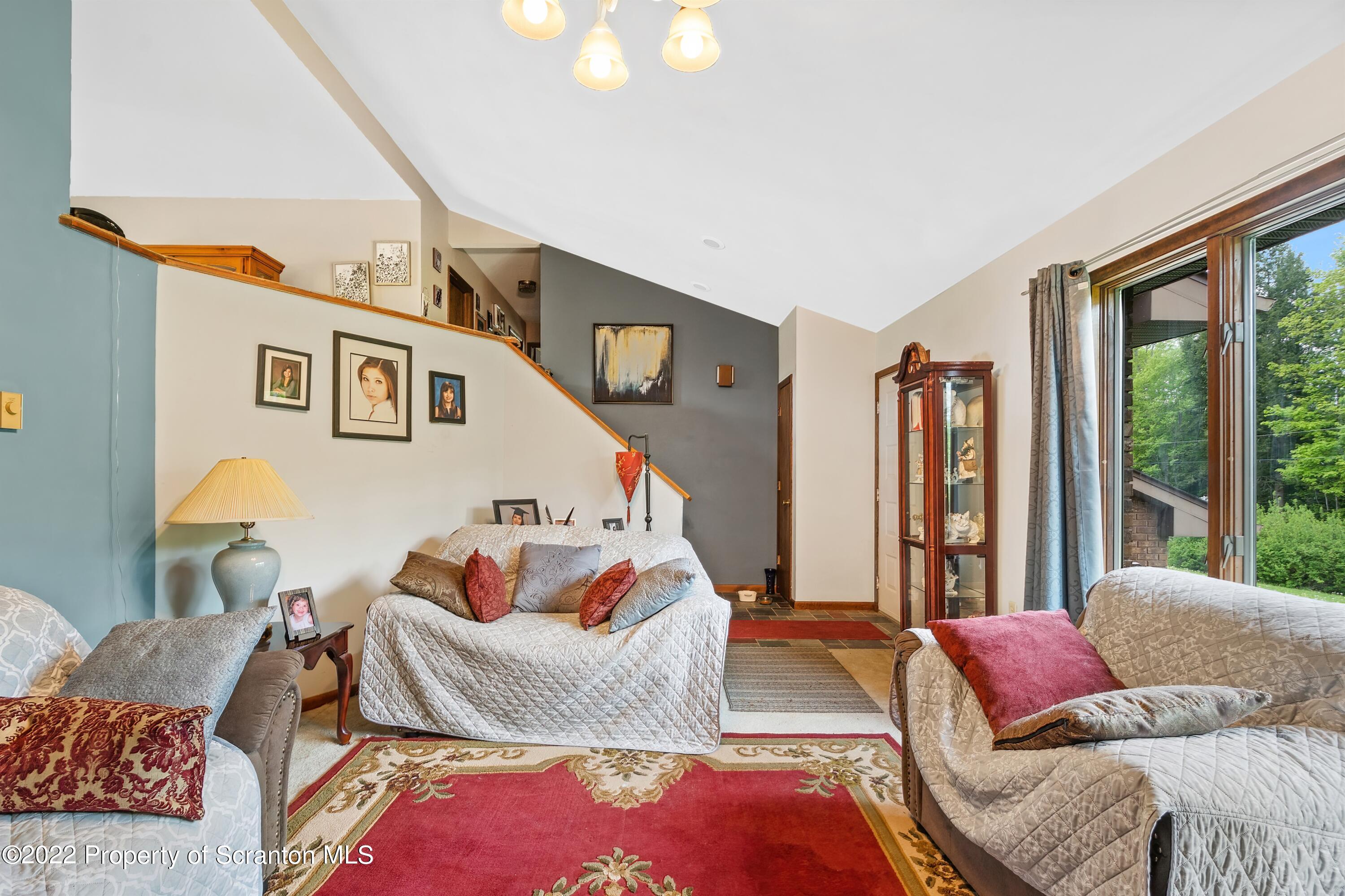 116 Hack Road Dalton, PA 18414 - Photo 12 of 33 a bedroom with furniture and a large window