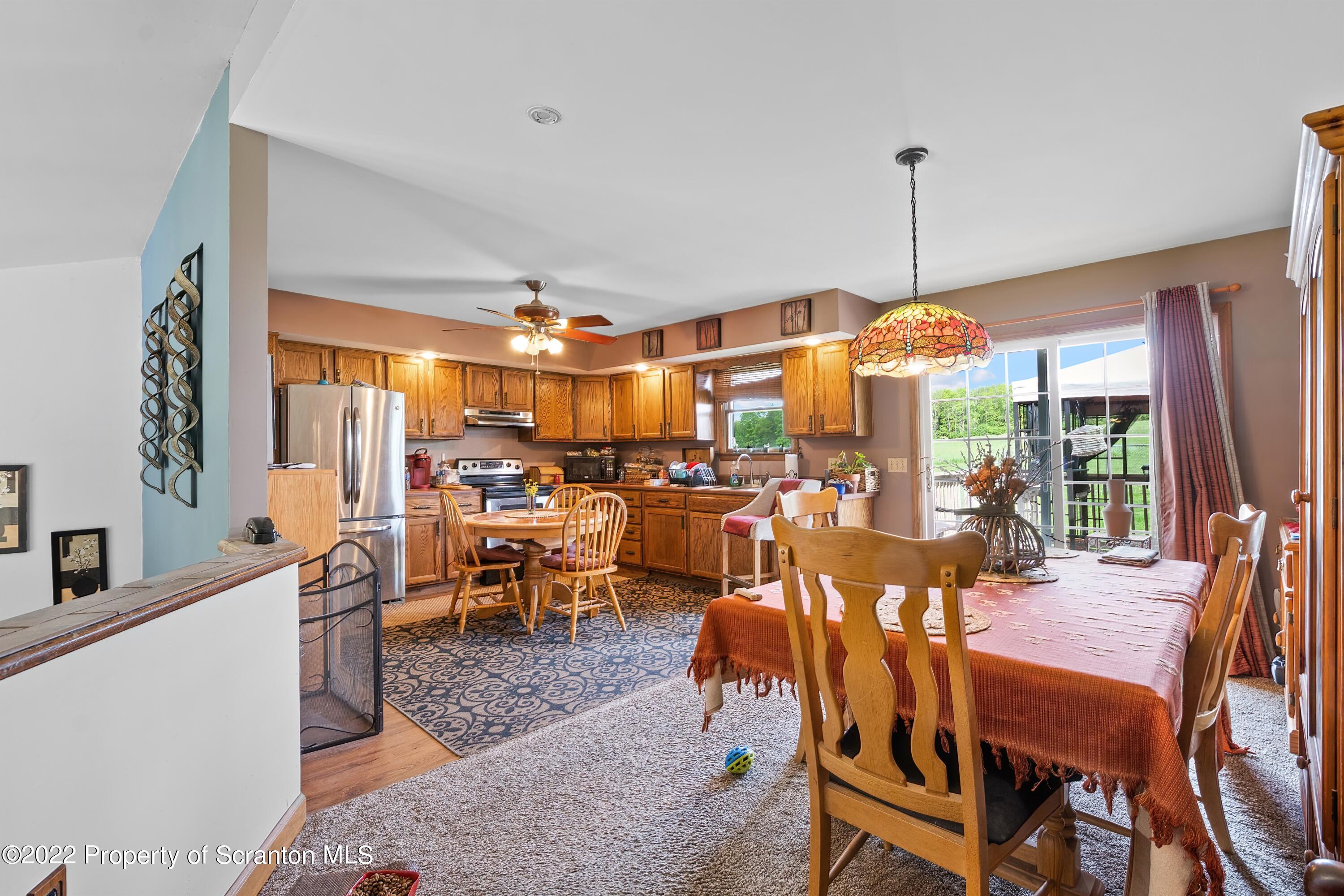 116 Hack Road Dalton, PA 18414 - Photo 13 of 33 a view of a dining room with furniture window and outside view
