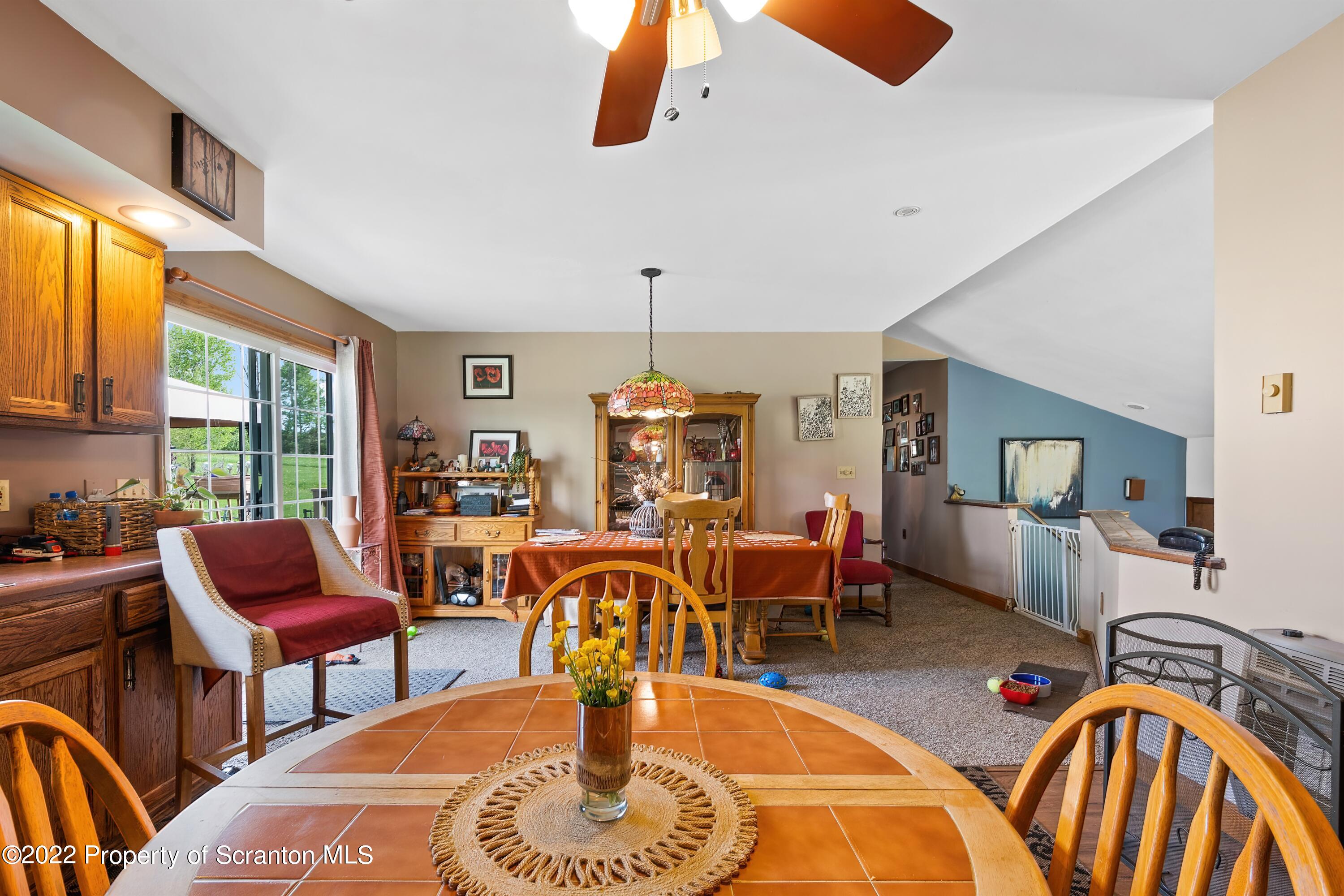 116 Hack Road Dalton, PA 18414 - Photo 18 of 33 a living room with furniture a rug and white walls