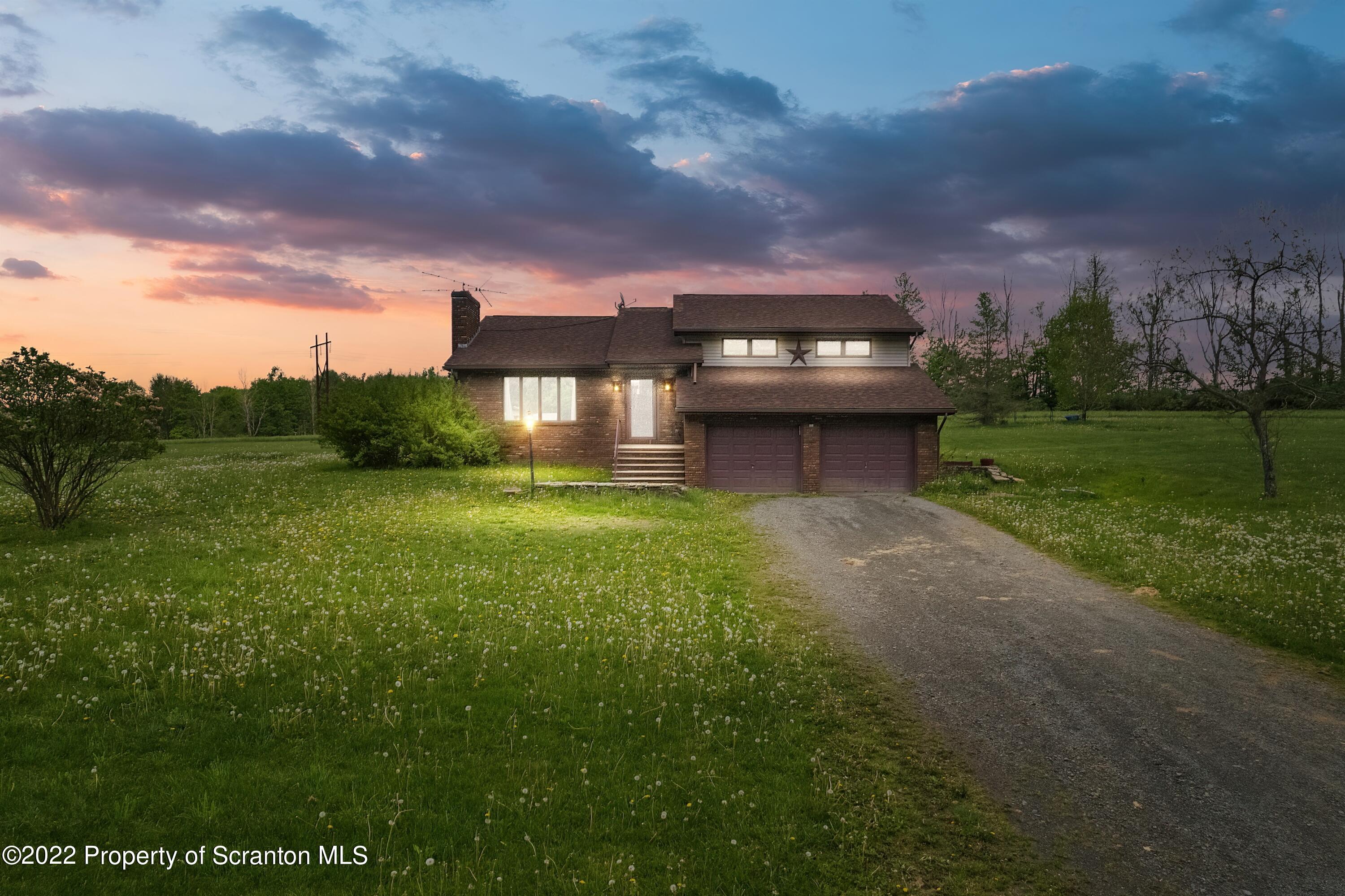116 Hack Road Dalton, PA 18414 - Photo 2 of 33 a view of a house with a back yard