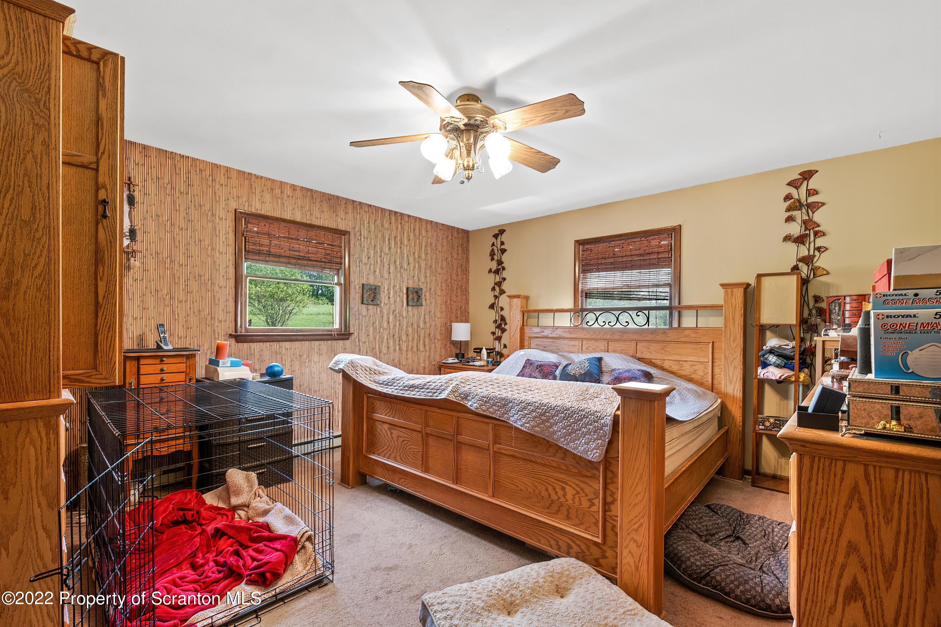 116 Hack Road Dalton, PA 18414 - Photo 25 of 33 a bed room with a bed and a window