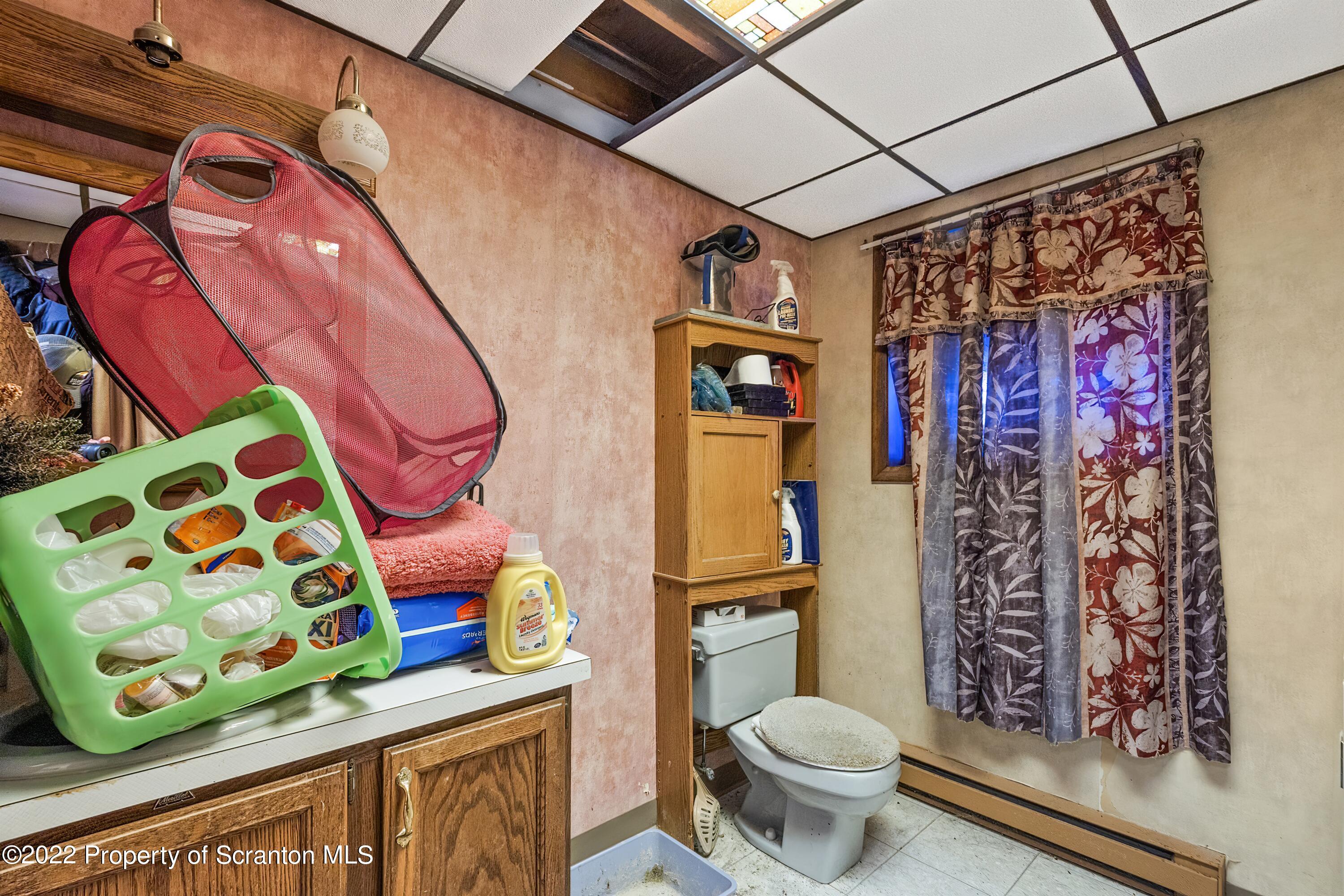 116 Hack Road Dalton, PA 18414 - Photo 29 of 33 a bathroom with a toilet sink and curtain