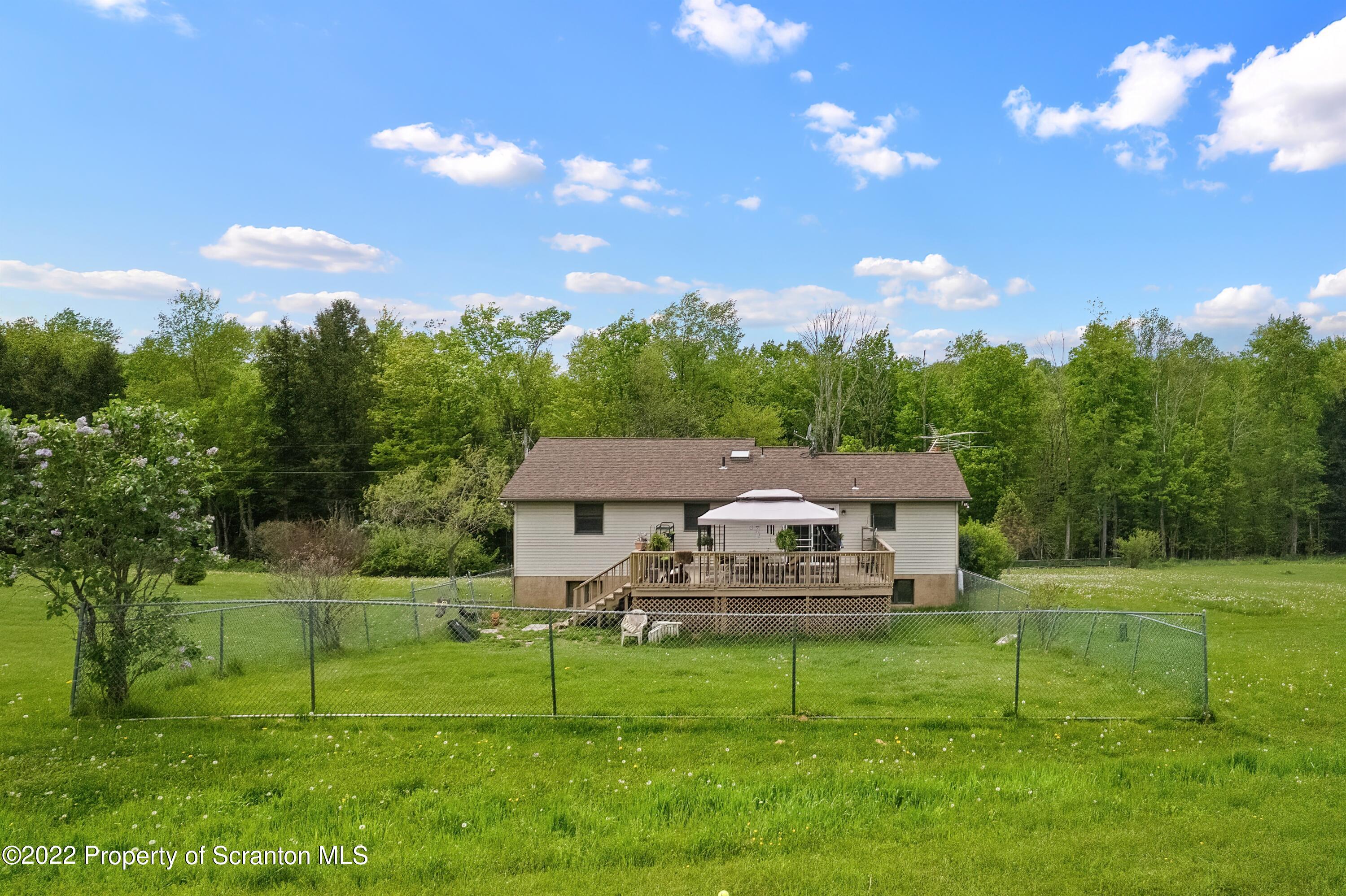 116 Hack Road Dalton, PA 18414 - Photo 4 of 33 a aerial view of a house with backyard and a garden