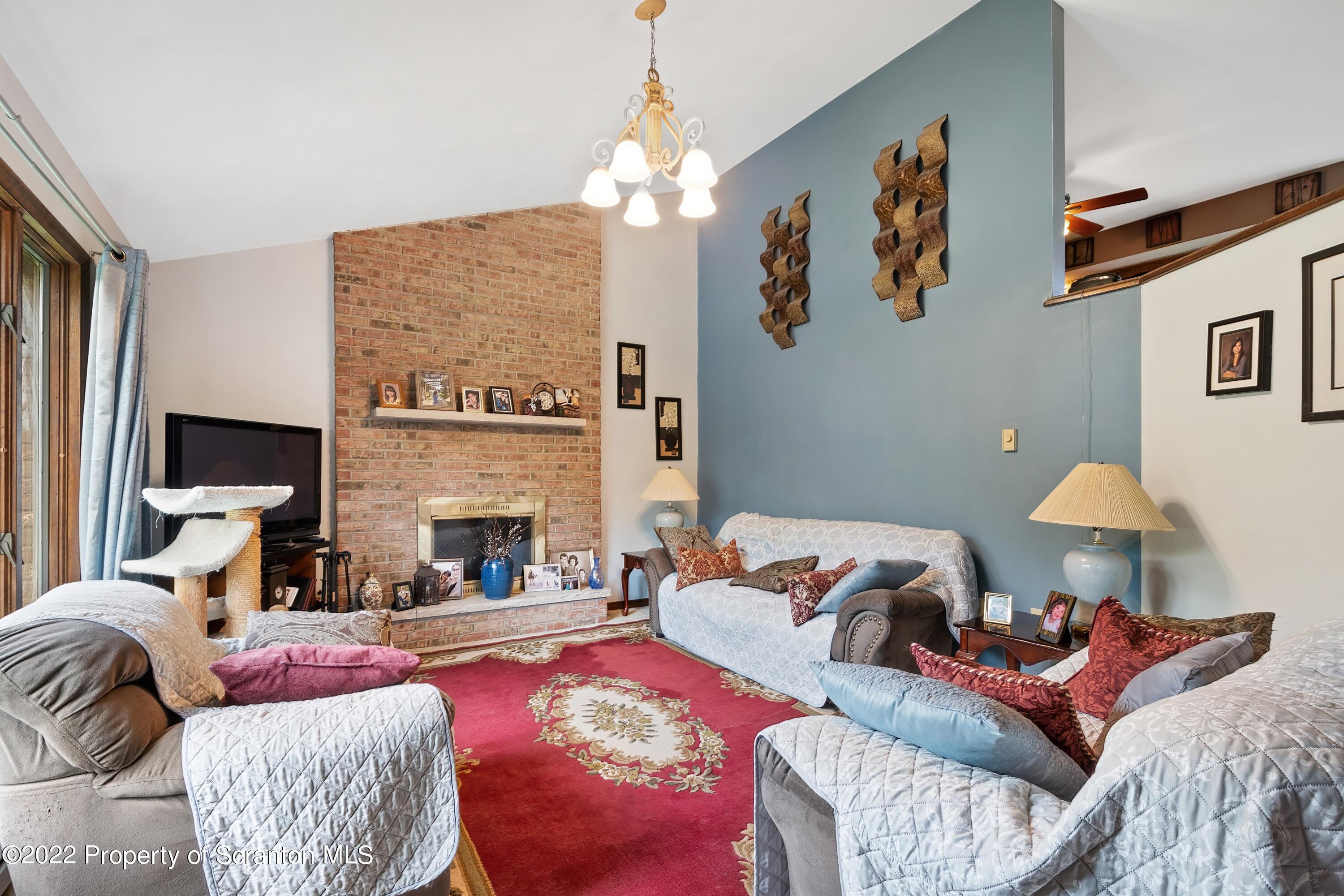 116 Hack Road Dalton, PA 18414 - Photo 10 of 33 a living room with furniture and a fireplace