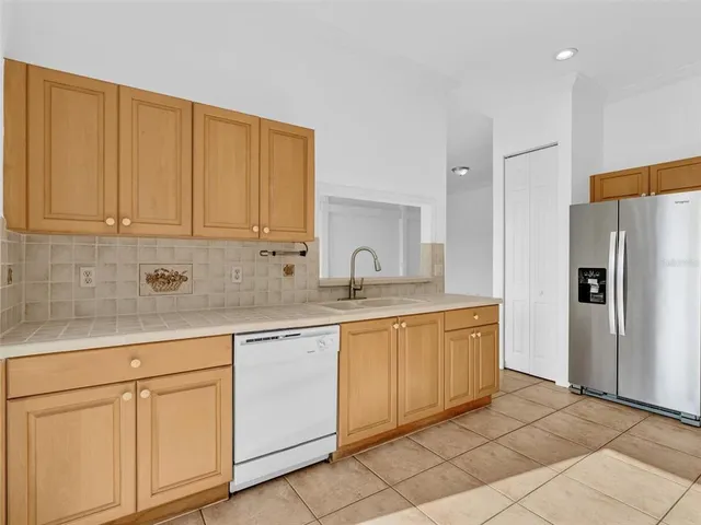 a bathroom with a double vanity sink mirror and shower
