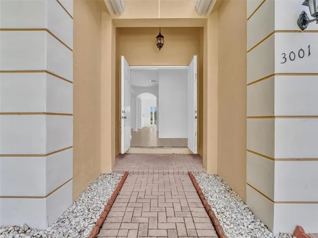 a living room with furniture and a view of bedroom