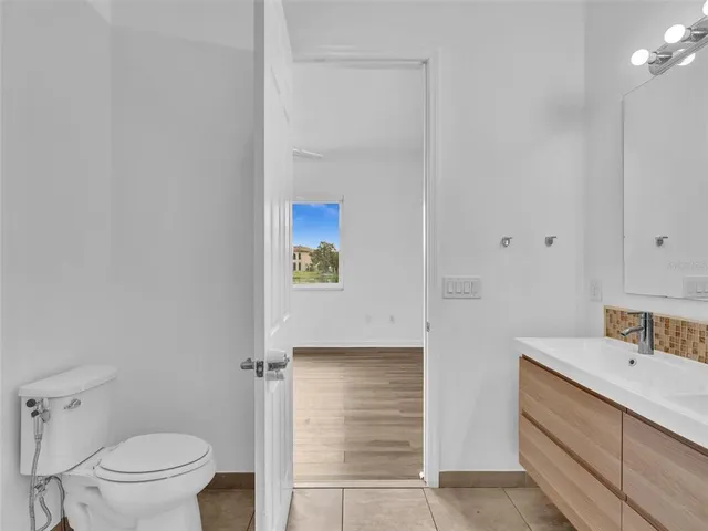 a bathroom with a sink toilet tub and shower