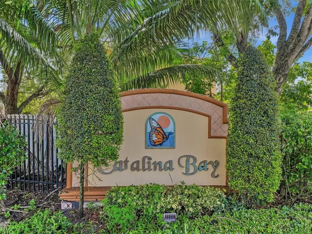an aerial view of a house with a lake view