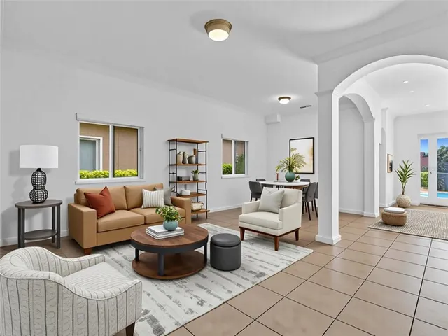 a view of a big room with windows and refrigerator