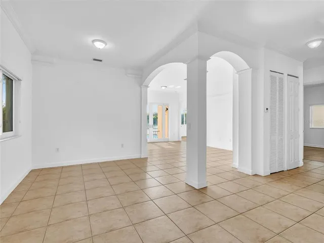 a view of a glass door and an empty room