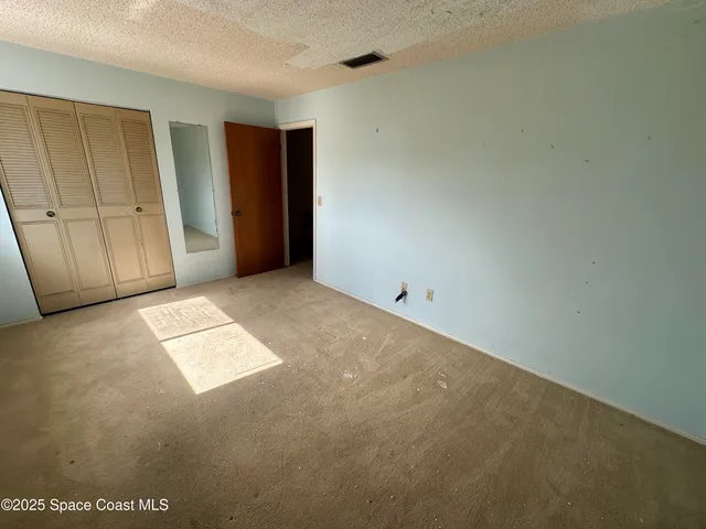 an empty room with closet