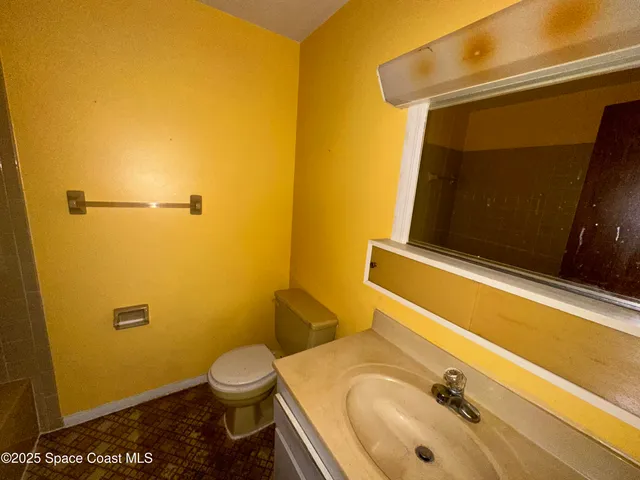 a bathroom with a sink and a toilet