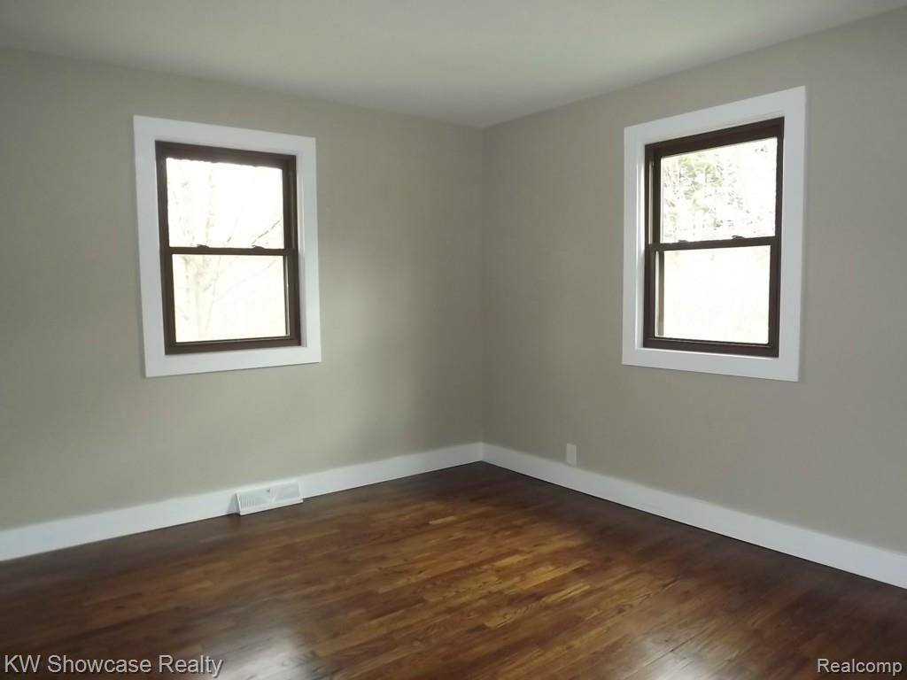 2033 Porter Road White Lake, MI 48383 - Photo 19 of 36 Bedroom with refinished original hardwood floors.
