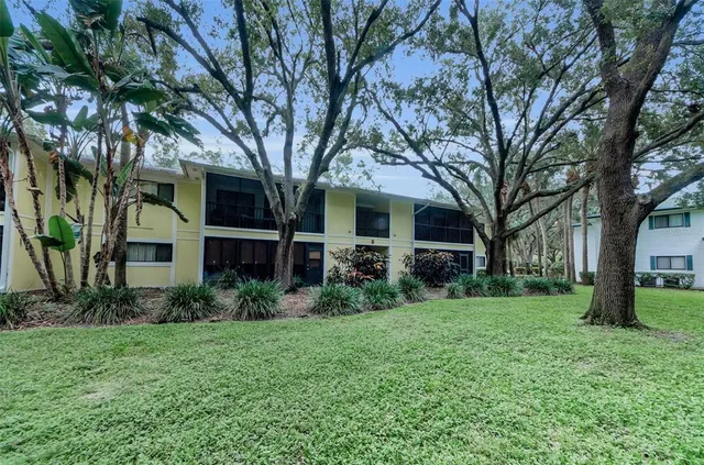 a view of a swimming pool and lounge chairs