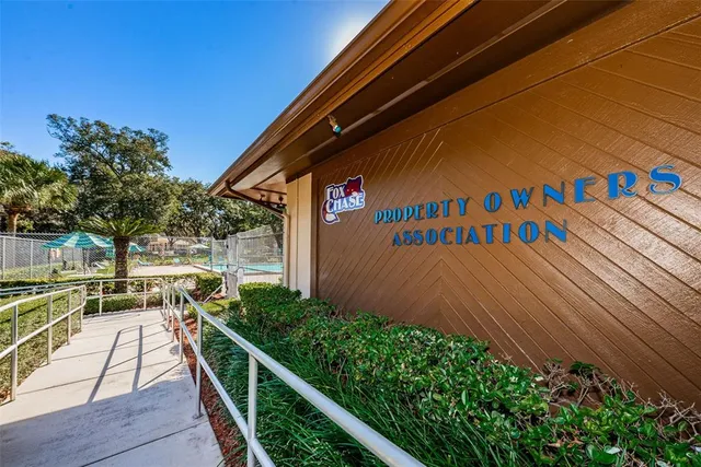 a view of a park with large trees