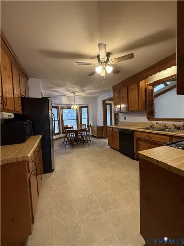 a kitchen with refrigerator and window
