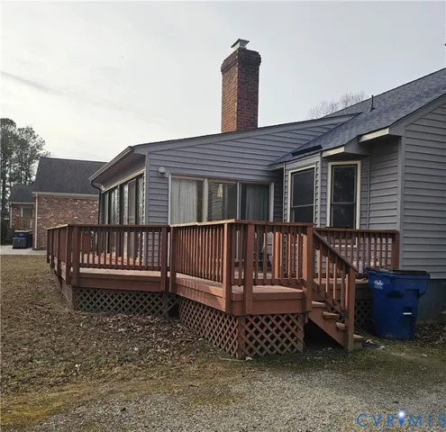 a view of a deck with a wooden fence