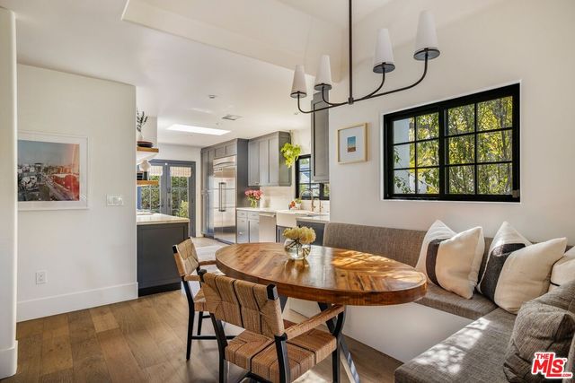 a kitchen with sink cabinets and wooden floor