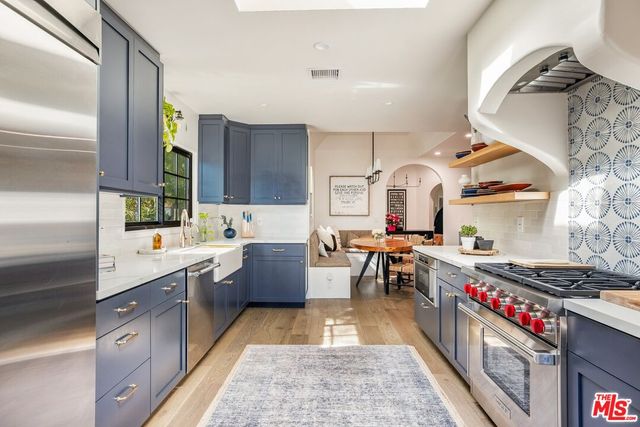 a kitchen with a sink and a window