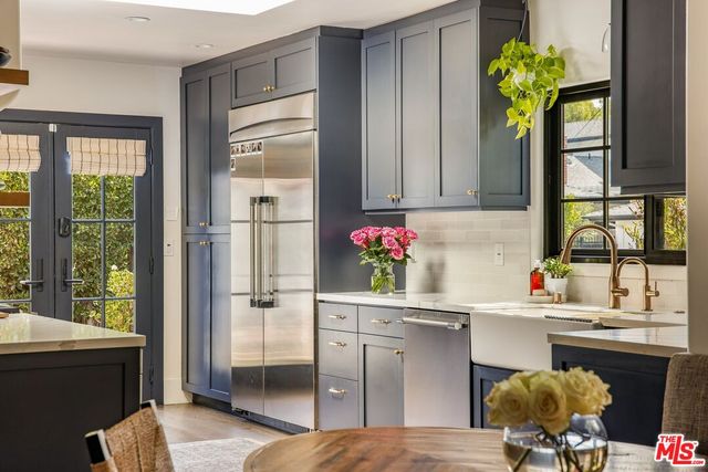 a spacious bedroom with a bed and a large window