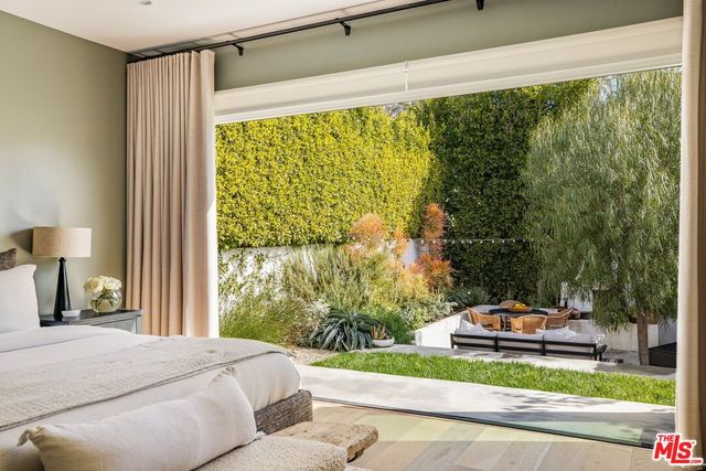 a bathroom with a sink mirror vanity and toilet