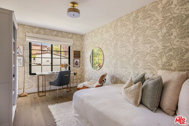 a bathroom with a double vanity sink toilet mirror and shower