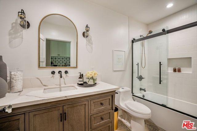 a view of backyard of house with seating space