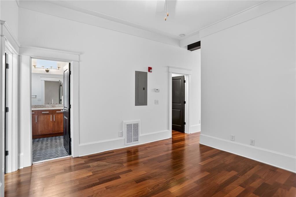1860 Gordon Manor Northeast, Unit 110 Atlanta, GA 30307 - Photo 13 of 20 a view of a hallway with wooden floor and a bathroom