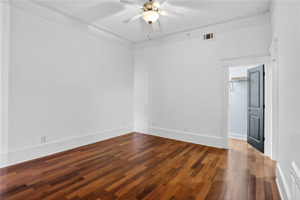 1860 Gordon Manor Northeast, Unit 110 Atlanta, GA 30307 - Photo 14 of 20 wooden floor in an empty room with a window