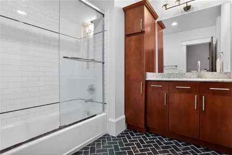 a bathroom with a bathtub and a shower