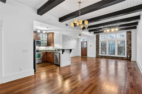 a view of a kitchen with a sink and cabinets