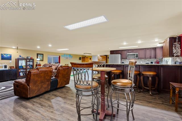 807 Fontmore Road Colorado Springs, CO 80904 - Photo 38 of 50 Dining space featuring wood-type flooring
