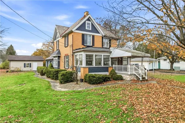 a front view of a house with garden