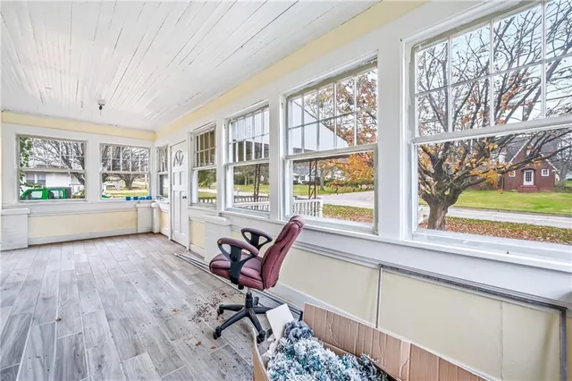a work room with furniture and a window