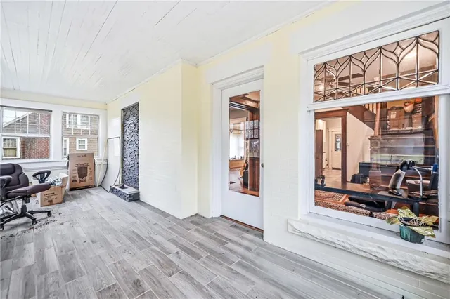 a view of a livingroom with furniture and windows